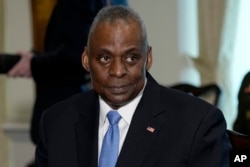 Defense Secretary Lloyd Austin attends a meeting with NATO Secretary General Jens Stoltenberg at the Pentagon in Washington, Jan. 29, 2024. (AP Photo/Susan Walsh)
