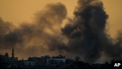 Smoke rises following an Israeli airstrike in the Gaza Strip, as seen from southern Israel, Oct. 15, 2023. 