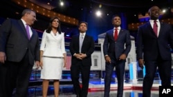 Republican presidential candidates from left, former New Jersey Gov. Chris Christie, former UN Ambassador Nikki Haley, Florida Gov. Ron DeSantis, businessman Vivek Ramaswamy and Sen. Tim Scott, R-SC, before a presidential primary debate hosted by NBC News, Nov. 8, 2023, in Miami.