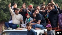 FILE — Sher Afzal Marwat, top center, senior vice president and election candidate of former Prime Minister Imran Khan's Pakistan Tehreek-e-Insaf party, leads a campaign rally in Hyderabad on Jan. 15, 2024, ahead of the country's general election. 