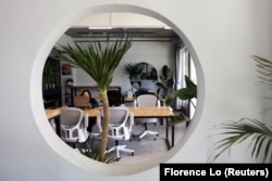 A woman works with a laptop at co-working space Wamo Lab in Dali, Yunnan province, China November 10, 2023. (REUTERS/Florence Lo)