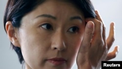 Japan's new Economy, Trade and Industry Minister Yuko Obuchi arrives at Prime Minister Shinzo Abe's official residence in Tokyo, Sept. 3, 2014.