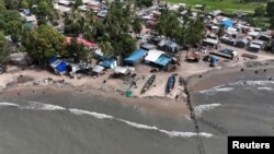 Wooden structures using the Maltais-Savard Ears System that is used to limit the erosion of the shoreline, in Diogue island, Senegal July 14, 2022. (REUTERS/Zohra Bensemra)