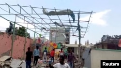 People inspect a damaged playground following an airstrike in Mekelle, the capital of Ethiopia's northern Tigray region, Aug. 26, 2022, in this still image taken from video. (Tigrai TV/Reuters TV via Reuters)