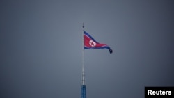 FILE - A North Korean flag flutters at the propaganda village of Gijungdong in North Korea, in this picture taken near the truce village of Panmunjom inside the demilitarized zone (DMZ) separating the two Koreas, South Korea, July 19, 2022. 