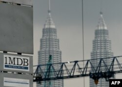 FILE - In this file photo taken on July 3 2015 the 1 Malaysia Development Berhad (1MDB) logo is seen on a billboard at the funds flagship Tun Razak Exchange under-development site in Kuala Lumpur.