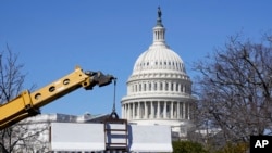 A barrier is placed behind a security fence in preparation for President Joe Biden's State of the Union address on Capitol Hill in Washington, Feb. 27, 2022.
