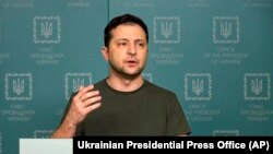 Ukrainian President Volodymyr Zelenskyy speaks to the nation in Kyiv, Feb. 27, 2022