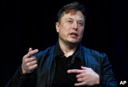 FILE -Tesla and SpaceX Chief Executive Officer Elon Musk speaks at a conference in Washington, March 9, 2020.