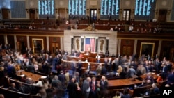 FILE - Lawmakers are seen in the House chamber during a roll call vote on Capitol Hill in Washington, Jan. 4, 2023.
