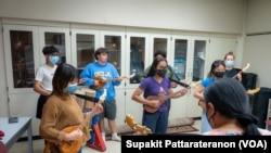 Students practice a traditional style of Thai music at the Department of Ethnomusicology of the traditional music and ritual of Thailand, UCLA.