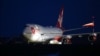Cosmic Girl, a Virgin Boeing 747-400 aircraft, sits on the tarmac with Virgin Orbit's LauncherOne rocket attached to the wing, ahead of the first U.K. launch, at Spaceport Cornwall at Newquay Airport in Newquay, Britain, Jan. 9, 2023. 