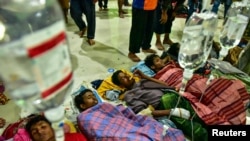 Rohingya refugees receive medical treatment after their arrival at the temporary shelter in Pidie, Aceh province, Indonesia, Dec. 26, 2022.