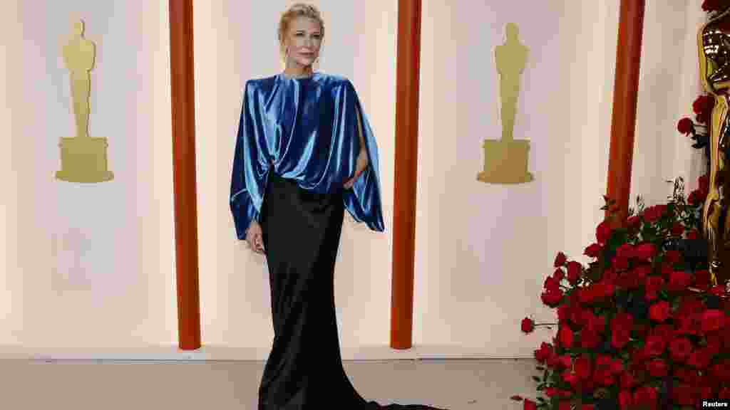 Cate Blanchett poses on the champagne-colored red carpet during the Oscars arrivals at the 95th Academy Awards in Los Angeles, March 12, 2023. (Photo by Eric Gaillard/Reuters)