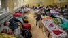 Niños ucranianos en un refugio improvisado en una escuela de Przemysl, cerca de la frontera entre Polonia y Ucrania, el 14 de marzo de 2022.