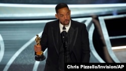 Will Smith cries as he accepts the award for best performance by an actor in a leading role for "King Richard" at the Oscars on Sunday, March 27, 2022, at the Dolby Theatre in Los Angeles. (AP Photo/Chris Pizzello)
