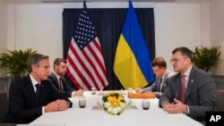 U.S. Secretary of State Antony Blinken, left, meets with Ukraine's Foreign Minister Dmytro Kuleba, right, on the sidelines of ASEAN summit held in Phnom Penh, Cambodia, Nov. 12, 2022.