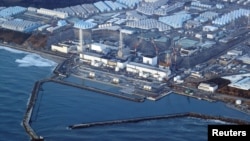 FILE - An aerial view shows the Fukushima Daiichi nuclear power plant following a strong earthquake, in Okuma town, Fukushima prefecture, Japan in this photo taken by Kyodo on March 17, 2022. (Kyodo/via Reuters)