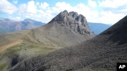 This undated photo provided by Elizabeth Turner shows a field location in Northwest Territories, Canada. Canadian geologist Elizabeth Turner may have found the earliest fossil record of animal life on Earth in the area. (Courtesy of Elizabeth Turner/Laurentian University via AP)