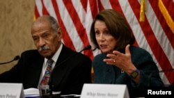 People dance and sing during a demonstration to mark International Women's Day in front of the parliament building in Athens, Greece.