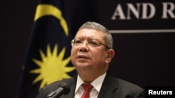 FILE - Malaysia's Foreign Minister Saifuddin Abdullah speaks during a news conference after ASEAN Summit in Kuala Lumpur, Malaysia, Oct. 28, 2021.