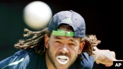 FILE - Australia's Andrew Symonds bowls in the nets during a traiing session on April 15, 2007, at the National Stadium at St. George's, Grenada.