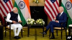 U.S. President Joe Biden, right, meets with Indian Prime Minister Narendra Modi during the Quad leaders summit at Kantei Palace, Tuesday, May 24, 2022, in Tokyo.