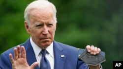 President Joe Biden tells reporters he will speak about the mass shooting at Robb Elementary School in Uvalde, Texas, later in the evening as he arrives at the White House, in Washington, from his trip to Asia, May 24, 2022.