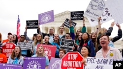 Demonstrators protest outside of the US Supreme Court, May 16, 2022, in Washington.