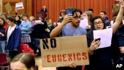 FILE - In this March 2, 2017, file photo, Middlebury College students turn their backs to author Charles Murray during his lecture in Middlebury, Vt. (AP Photo/Lisa Rathke, File)