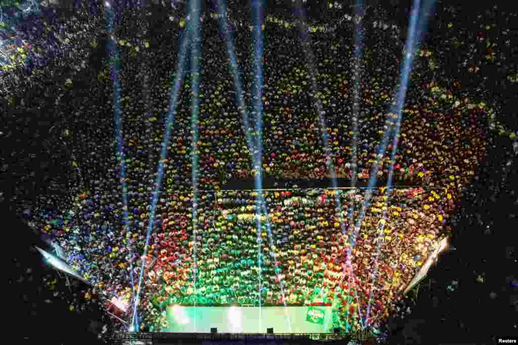 Spectators watch a match of FIFA World Cup Qatar 2022 between Brazil and Switzerland, on big screen at the University of Dhaka, Bangladesh.