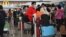 Passengers queue to check-in at the international airport in Hong Kong on Dec. 28, 2022. 