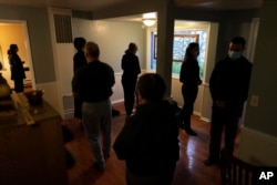 Members of the Anchorage Zen Community walk in silence as they meditate during a Sunday service in Anchorage, Alaska, Oct. 9, 2022. (AP Photo/Jae C. Hong)
