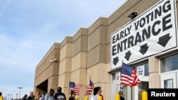 Residents wait in line to cast their ballots for the 2022 midterm election at the Franklin County Board of Elections during early voting hours in Columbus, Ohio, Nov. 5, 2022. 