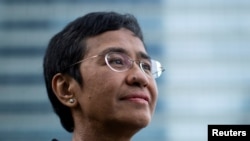 File - Filipino journalist Maria Ressa, one of 2021 Nobel Peace Prize winners, poses for a portrait in Taguig, Philippines, October 9, 2021.