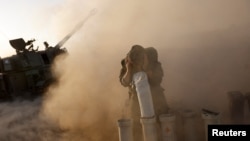 Israeli military units operate at an undisclosed location near the Gaza Strip border