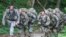 FILE - U.S. Army Ranger candidate soldiers, burdened with heavy packs and weapons, conduct Mountaineering training during the Ranger Course on Mount Yonah in Cleveland, Georgia, July 14, 2015.
