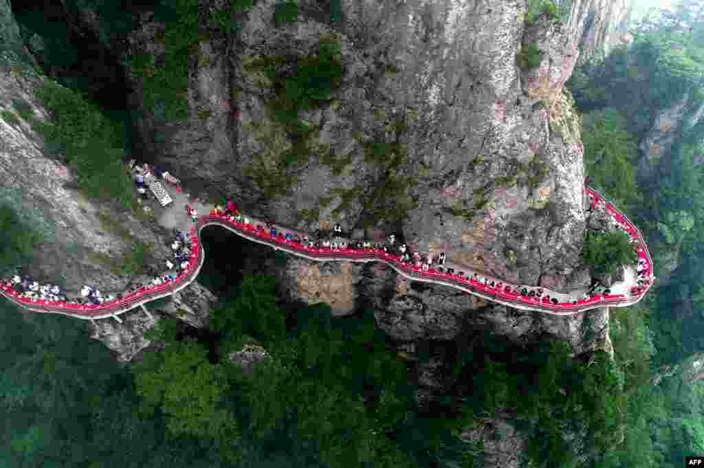 An aerial view of a banquet held along the edge of a cliff, at Laojun Mountain in Luoyang in China's central Henan province. The banquet was held on a mountain cliff 2,000-meters (6,500-ft.) above sea level to attract tourists.