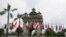 Flags of the 10-member ASEAN (Association of Southeast Asian Nations) and its dialogue partners are placed around the Patuxay Monument in downtown Vientiane, Laos, Sept. 5, 2016. 