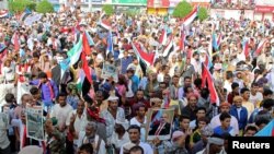 Supporters of UAE-backed southern separatists march during a rally in southern port city in Aden, Yemen, Aug. 15, 2019.