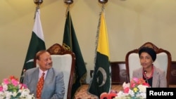 U.S. Representative Ilhan Omar, along with the President of Azaz Kashmir Sultan Mehmood Chaudhry, speaks to the media during her visit to Muzaffarabad, Pakistan-administrated Kashmir, Pakistan, April 21, 2022. 