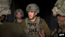 This handout picture released by the Israeli army on August 14, 2024 reportedly shows the Israeli Army Chief of General Staff Lieutenant-General Herzi Halevi (C) during a situational assessment at the Philadelphi Corridor in the Rafah area in the southern