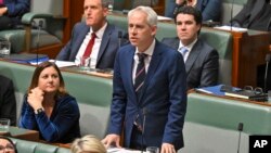 FILE - Australian Minister for Immigration Andrew Giles, shown here at Parliament House in Canberra on Sept. 12, 2023, says a new law that forces recently released immigrant detainees to adhere to strict visa restrictions was designed “to keep the community safe."