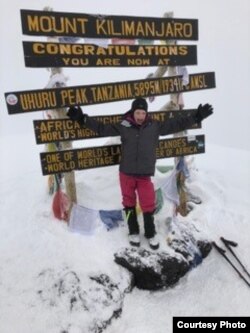 Montannah Kenney, 7, of Texas reaches the top of Mt. Kilimanjaro. (Photo courtesy of Hollie Kenney)