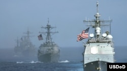 Namee Barakat, father of shooting victim Deah Shaddy Barakat, cries as a video is played during a vigil on the campus of the University of North Carolina in Chapel Hill, N.C., Feb. 11, 2015. 