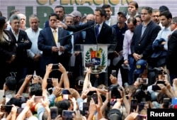 Venezuelan opposition leader Juan Guaido, who many nations have recognized as the country's rightful interim ruler, speaks during a meeting with political leaders in Caracas, Venezuela, March 27, 2019.