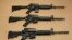 FILE -- Three variations of the AR-15 assault rifle are displayed in Sacramento, Calif. While the guns look similar, the bottom version is illegal in California because of its quick reload capabilities. Omar Mateen used an AR-15 that he purchased legally 