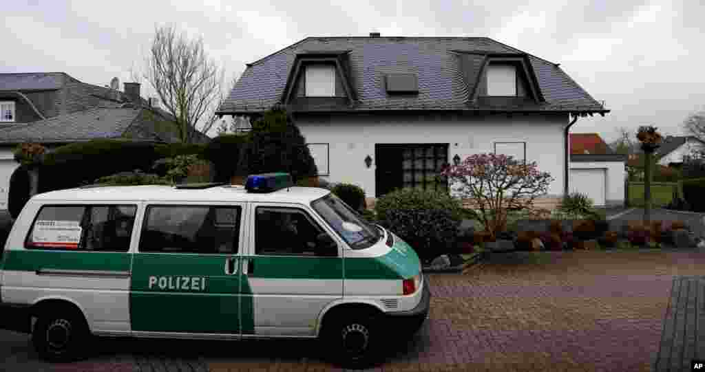 A police car waits in front of the family house of Andreas Lubitz, co-pilot of the Germanwings plane that crashed in the Alps, in Montabaur, Germany, March 27, 2015.