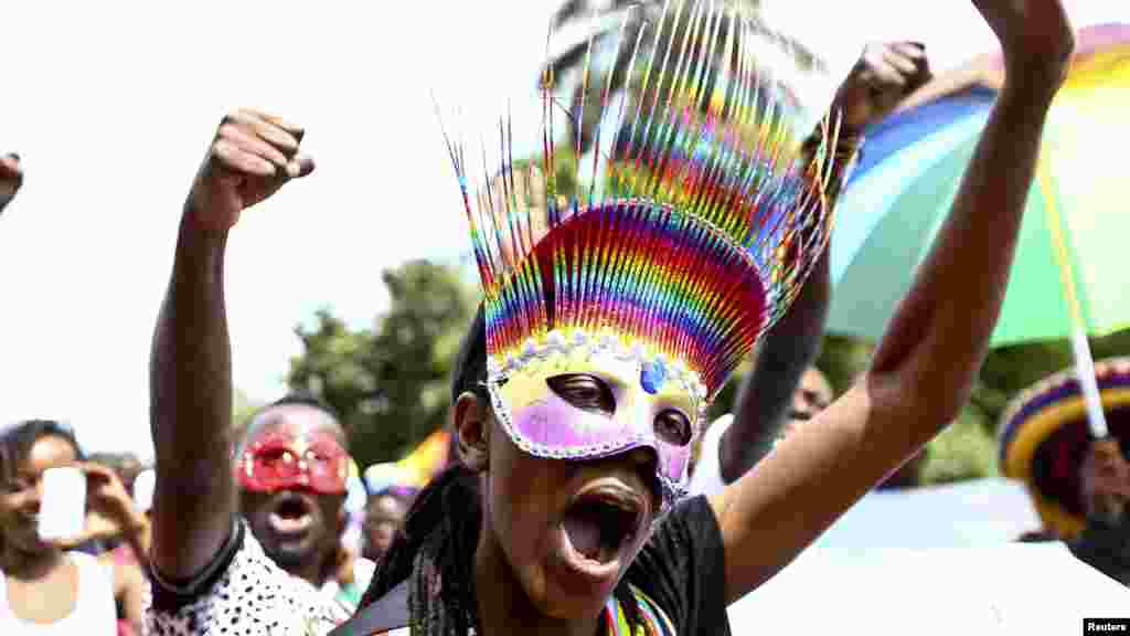 People walk in a parade as they celebrate the annulment of an anti-homosexuality law by Uganda's constitutional court in Entebbe, Aug. 9, 2014.
