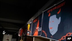 FILE - Anti-Chinese government posters are displayed at the June 4th Museum in Hong Kong, May 20, 2020. 